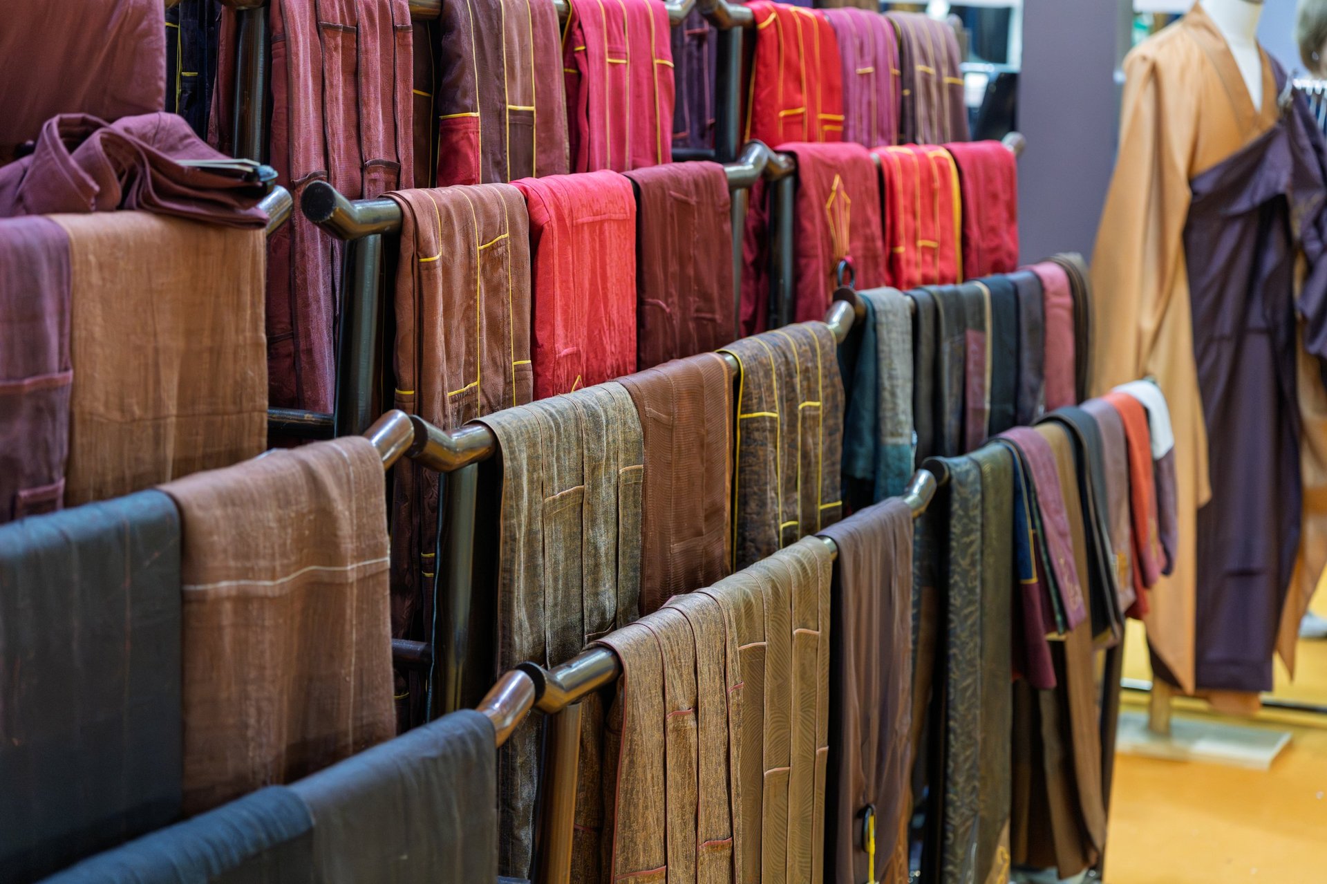 Neatly displayed various monk robes fabric in store