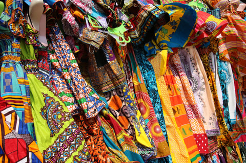 Beautiful decorated stalls offer colorful African Textiles in Lomé, Togo, West Africa.